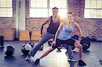 Fit couple doing stretching exercises