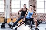 Fit couple doing stretching exercises