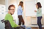 Portrait of happy businessman on wheelchair