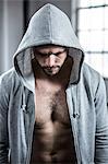 Fit man with hooded jumper