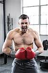 Fit man boxing with gloves