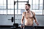 Fit man using skipping rope