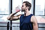 Fit man drinking his protein shake