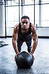 Fit man working out with ball