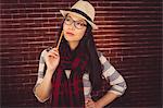 Attractive hipster posing with a pencil