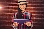 Attractive hipster holding her tablet