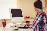 Young creating woman typing on keyboard