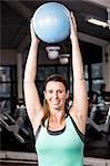 Pregnant woman working out with a ball