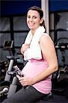 Pregnant woman riding bike