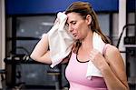 Pregnant woman wiping her sweating