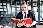 Lawyer reading a book attentively