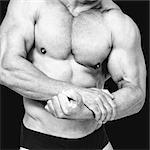 Composite image of midsection of shirtless man flexing  muscles