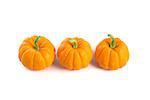 Small orange pumpkins, top view, isolated on white background