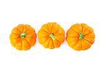 Decorative orange pumpkins, top view isolated on white background