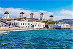 Two of the famous windmills in Mykonos, Greece during a clear and bright summer sunny day