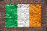 Flag of Ireland painted over old brick wall