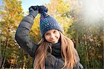 Portrait of smiling young girl in cold weather dressed warm hat