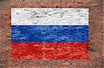 Flag of Russsia painted over old brick wall