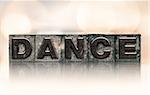 The word "DANCE" written in vintage ink stained letterpress type.