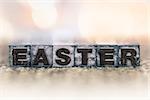 The word "EASTER" written in vintage ink stained letterpress type.