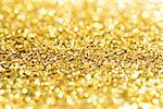 Gold bokeh glitter background with copy space