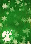 Vertical grunge Christmas background of green color with snowflakes, angel  and paper texture