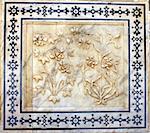 Ancient carved flower on marble in Amber Fort near Jaipur, Rajasthan, India