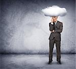 Sad businessman with cloud above head on grey background