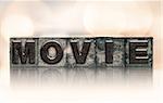 The word "MOVIE" written in vintage ink stained letterpress type.