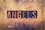 The word "Angels" written in dirty vintage letterpress type on a aged wooden background.