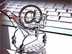 At sign, inside of the shopping cart on a laptop. E commerce concept. Depth of field with focus on At sign.