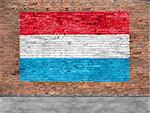 Flag of Luxembourg painted on brick wall