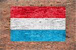 Flag of Luxembourg painted on brick wall