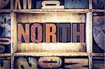 The word "North" written in vintage wooden letterpress type.