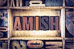 The word "Amish" written in vintage wooden letterpress type.