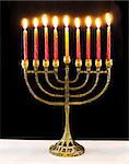 jewish holiday Hanukkah background with menorah Burning candles isolated on black