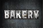 The word "Bakery" written in vintage metal letterpress type on a black industrial grid background.