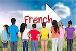 The word french and elementary pupils in a row against sunny landscape