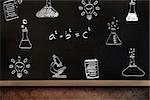School doodles against blackboard on wall