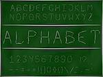 The font in the form of engraving on a blackboard