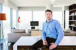 Man with cool attitude in apartment with woman in background