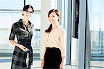 Portrait of two female architects in modern office