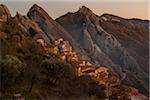 Scenic view of the sandstone rocks and mountain village of Castelmezzano at sunset, Lucanian Dolomites, Basilicata, Italy