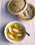 Clear ginger broth with steamed dumplings (China)