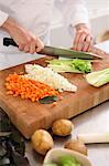 A chef dicing vegetables