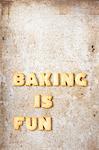 The words 'Baking is fun' made from biscuit letters