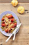 Sausage with onions, peas and bread rolls