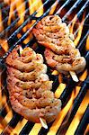 Prawn skewers on a grill (close up)