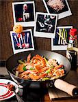 Fried prawns with spring onions in a wok