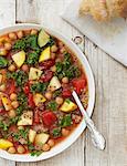 Vegan minestrone soup with kale, courgette, chickpeas and quinoa